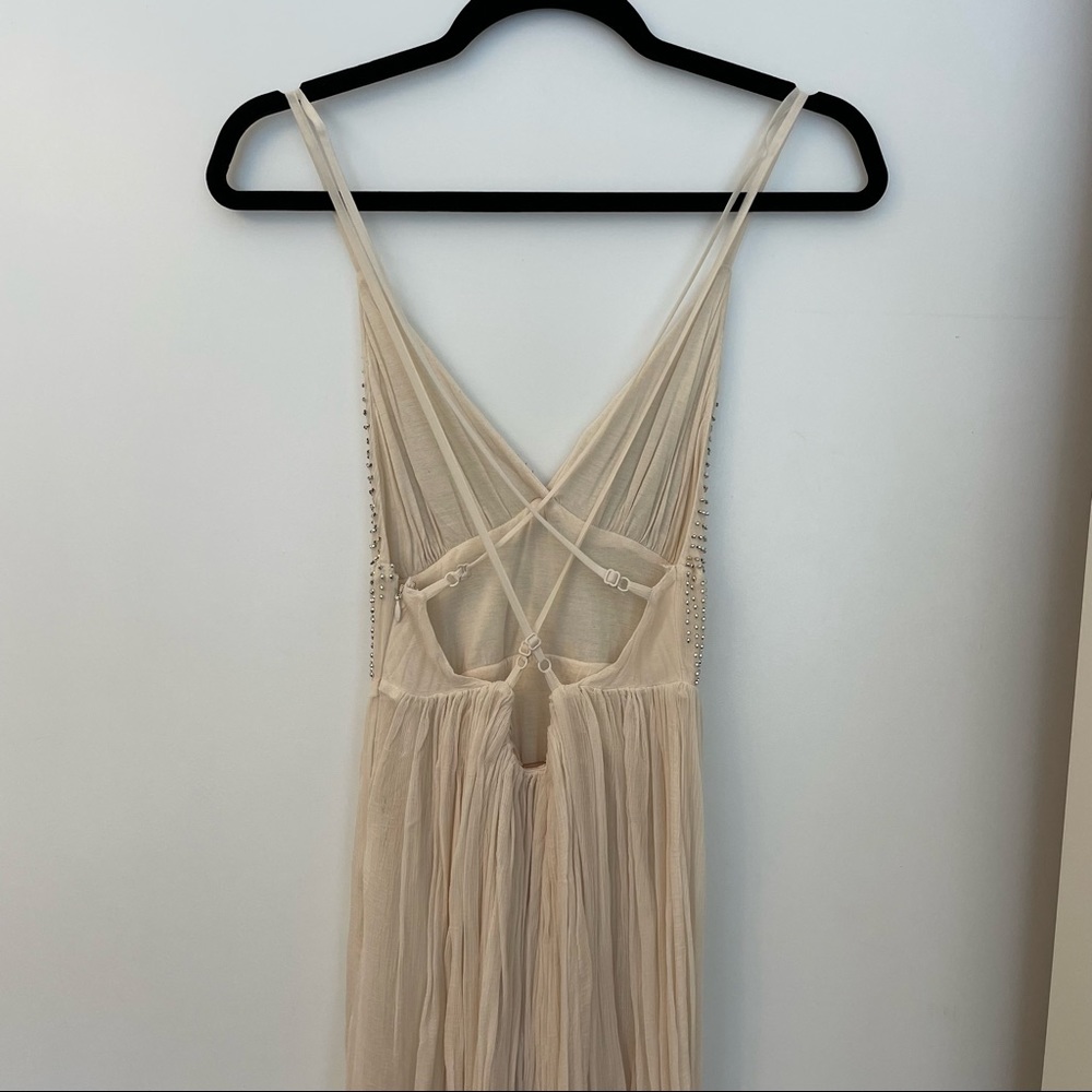 Free People Cream sparkly mini dress with a strappy back!
Size: 2 Never worn! - Picture 2 of 4